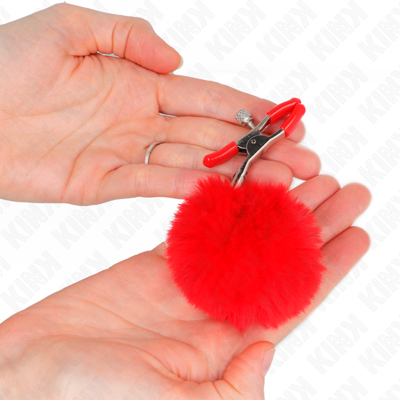KINK – Pince à tétons avec pompons en fourrure rouge